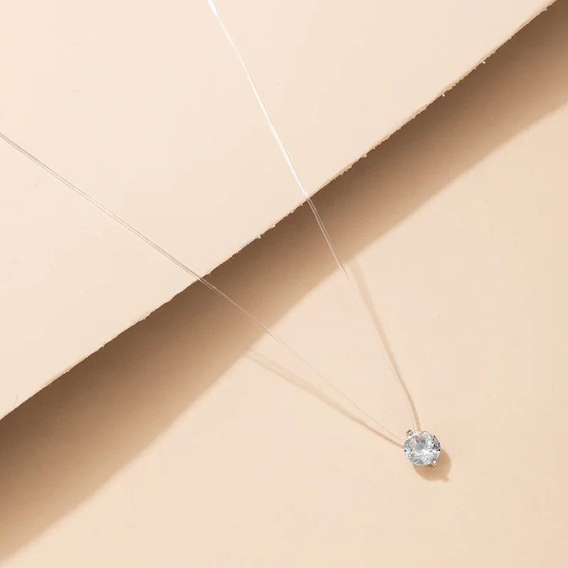 Choker med rund rhinsten og gennemsigtig tråd